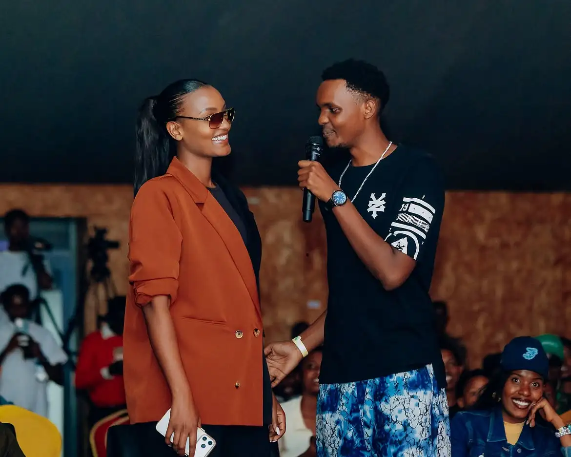 Dudu, one of the comedians, jokes with Kate Bashabe during the Gen-Z Comedy show at Camp Kigali.