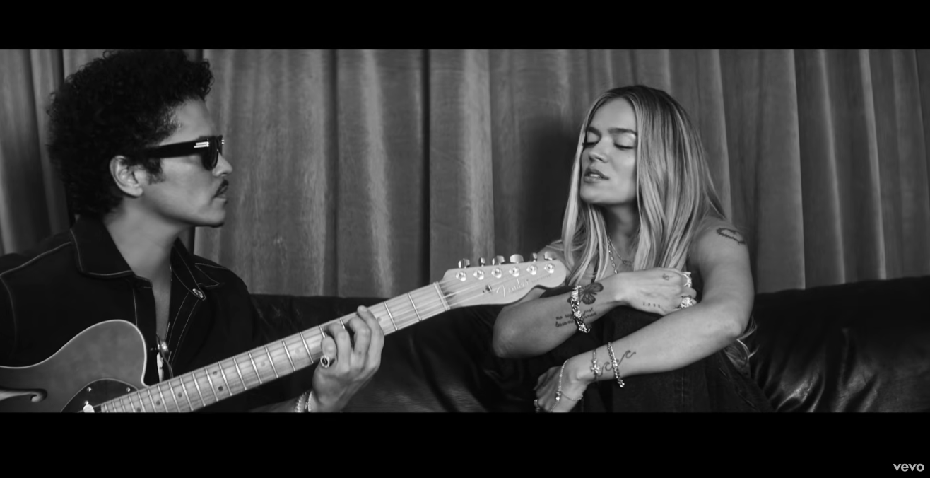 Karol G and Bruno Mars Release New “Still” Music Video