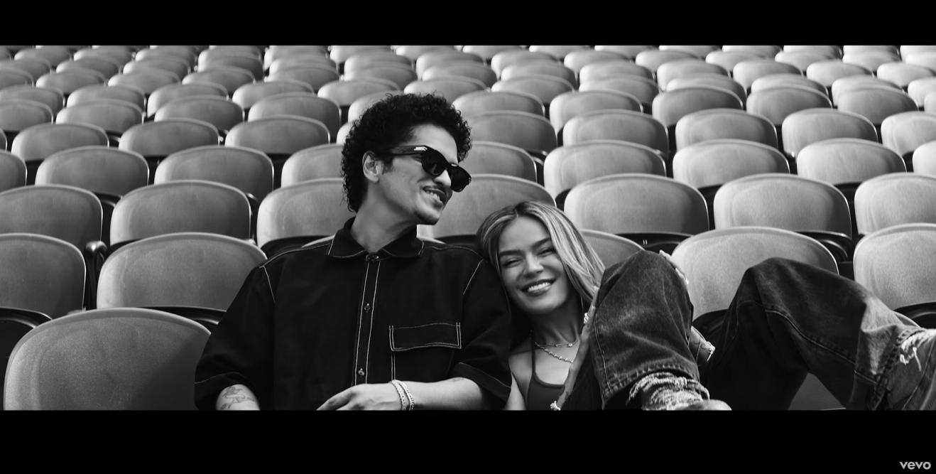 Karol G and Bruno Mars Release New “Still” Music Video