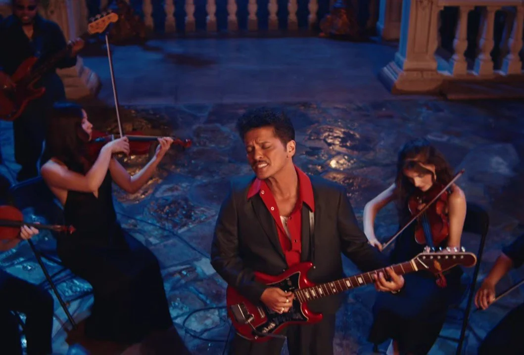 Bruno Mars and Karol G Reunite in ‘Dance With Me’ Music Video